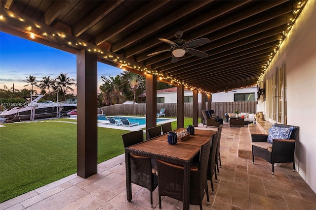 view of patio featuring outdoor lounge area, ceiling fan, a fenced backyard, outdoor dining space, and a fenced in pool