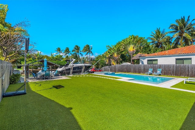 view of swimming pool with a fenced backyard, a gazebo, a fenced in pool, and a lawn