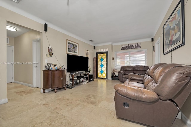 living room featuring visible vents and baseboards