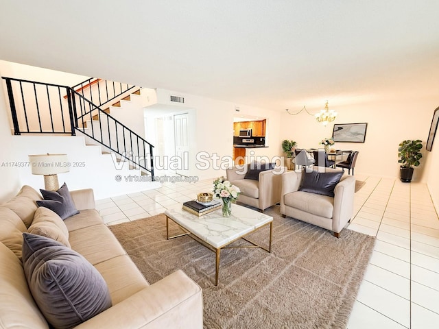 tiled living room with visible vents, an inviting chandelier, and stairway