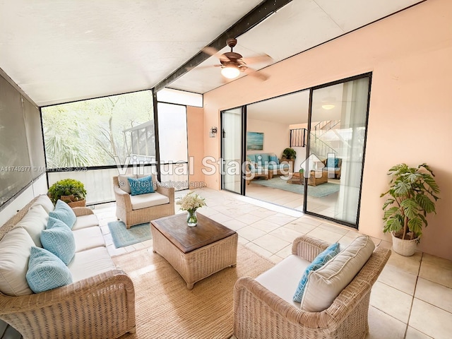 sunroom with beamed ceiling and ceiling fan