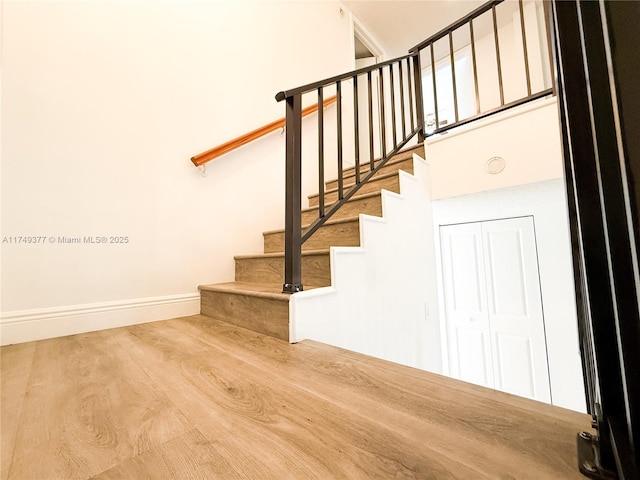 stairway featuring baseboards