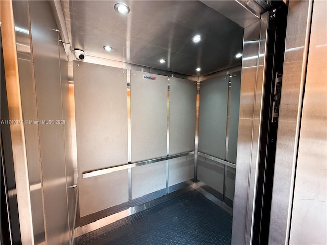 interior details with recessed lighting and elevator