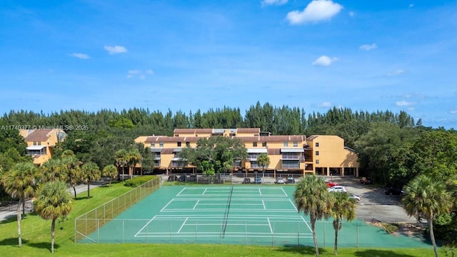 view of tennis court with fence