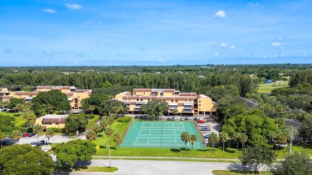 drone / aerial view featuring a view of trees