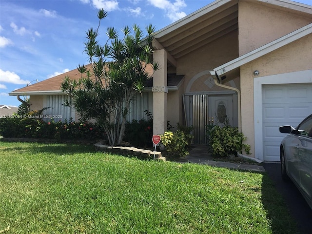 view of property exterior featuring an attached garage, a lawn, and stucco siding