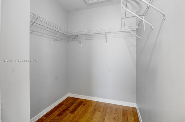 spacious closet with wood finished floors