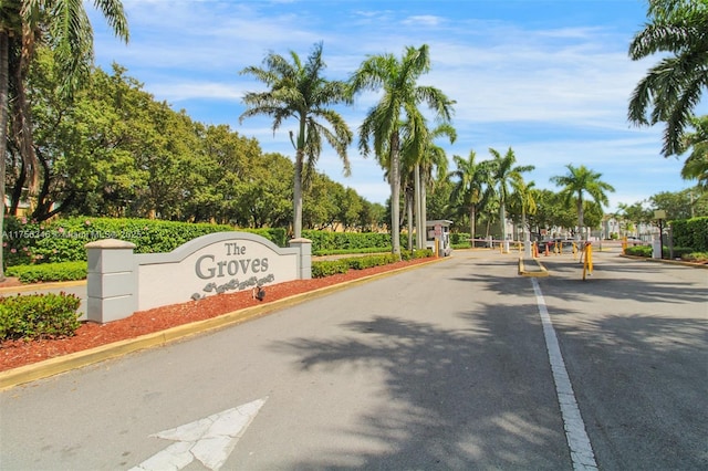 view of road featuring curbs and a gated entry