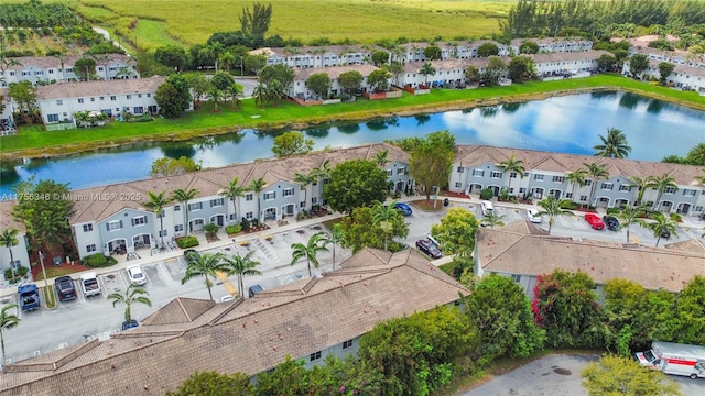 bird's eye view featuring a water view and a residential view