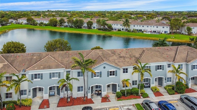 aerial view featuring a water view and a residential view