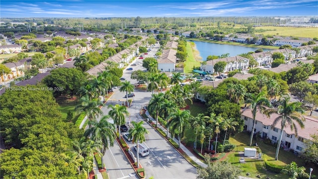 aerial view with a water view and a residential view