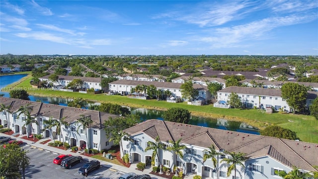 aerial view with a residential view and a water view