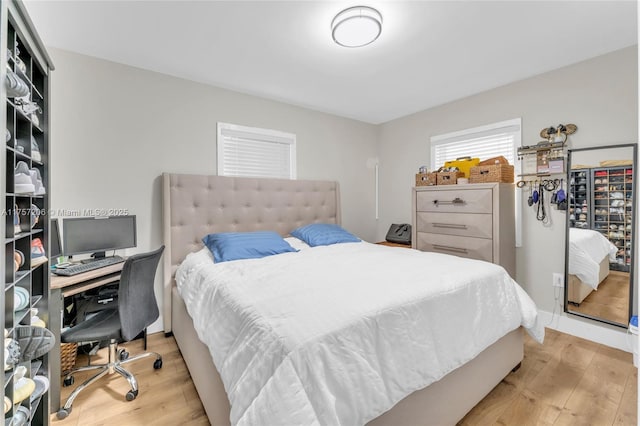 bedroom with light wood finished floors