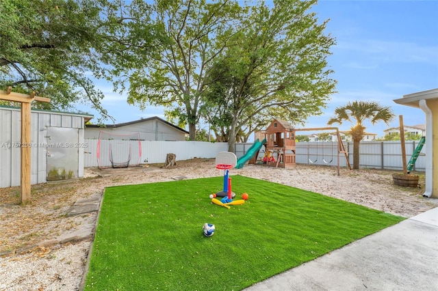 view of yard featuring a fenced backyard and a playground