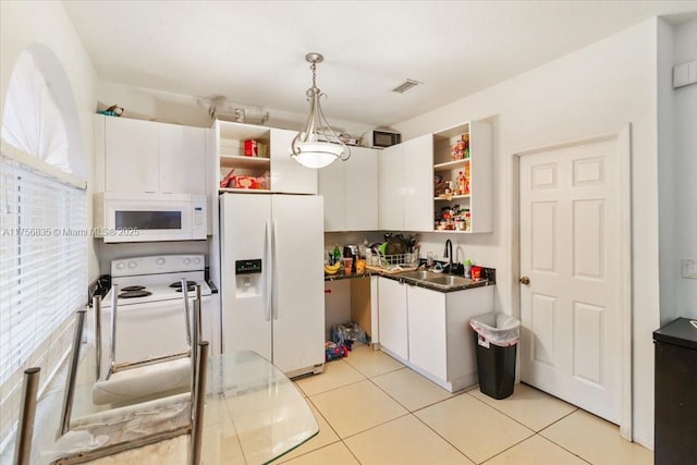 kitchen with light tile patterned flooring, white appliances, a sink, white cabinetry, and open shelves