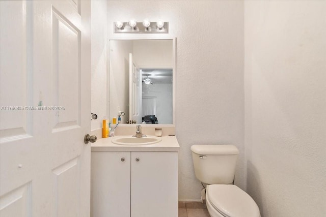 half bath with toilet and vanity