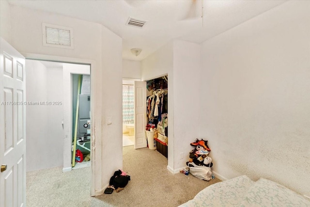 bedroom featuring carpet, visible vents, and a ceiling fan