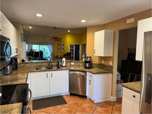 kitchen with white cabinetry, range with electric cooktop, a sink, and dishwasher
