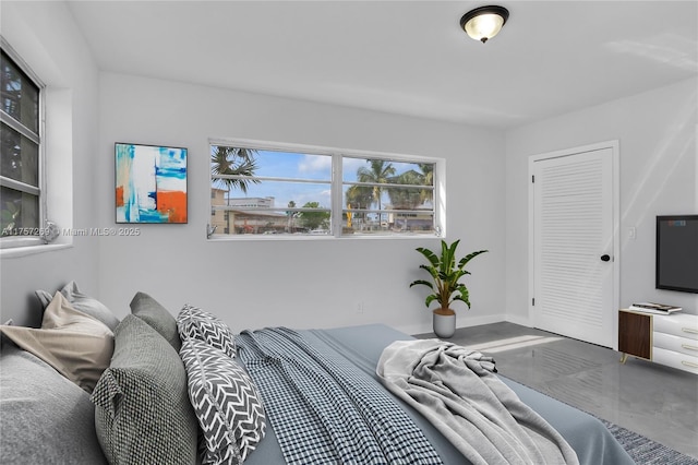 bedroom featuring baseboards