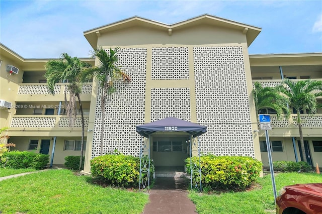 view of property featuring a wall mounted AC