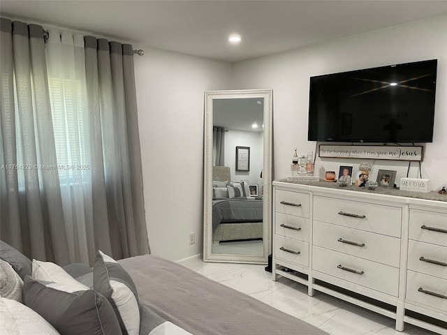 bedroom featuring recessed lighting and marble finish floor