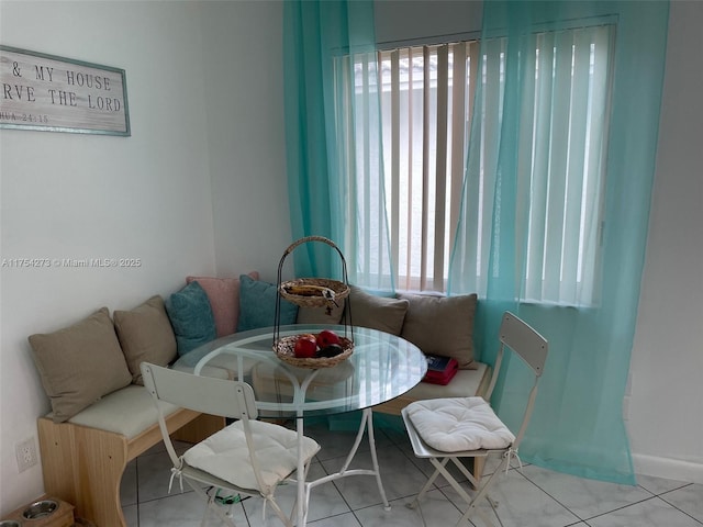 dining area featuring tile patterned flooring