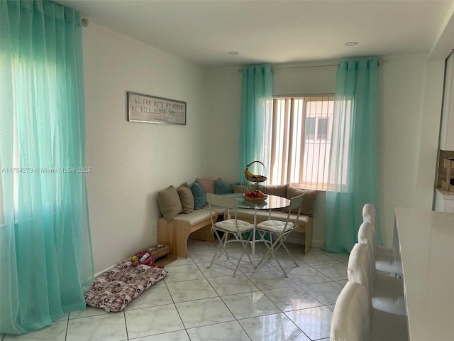 living area with light tile patterned floors