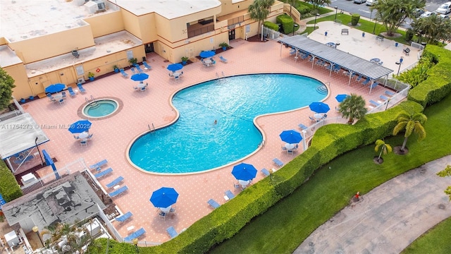 pool featuring a patio area and fence