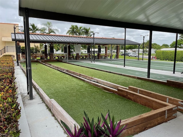 view of home's community featuring shuffleboard