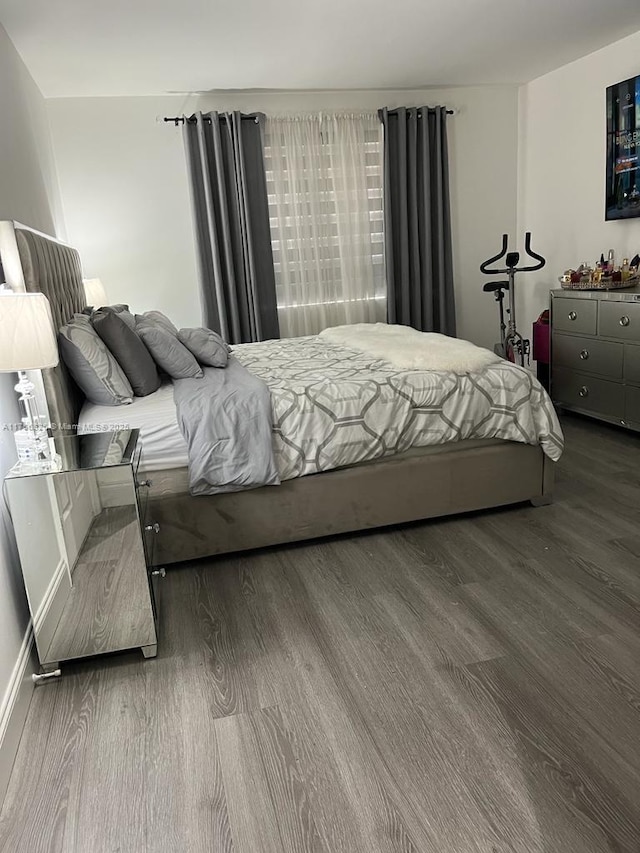 bedroom featuring wood finished floors