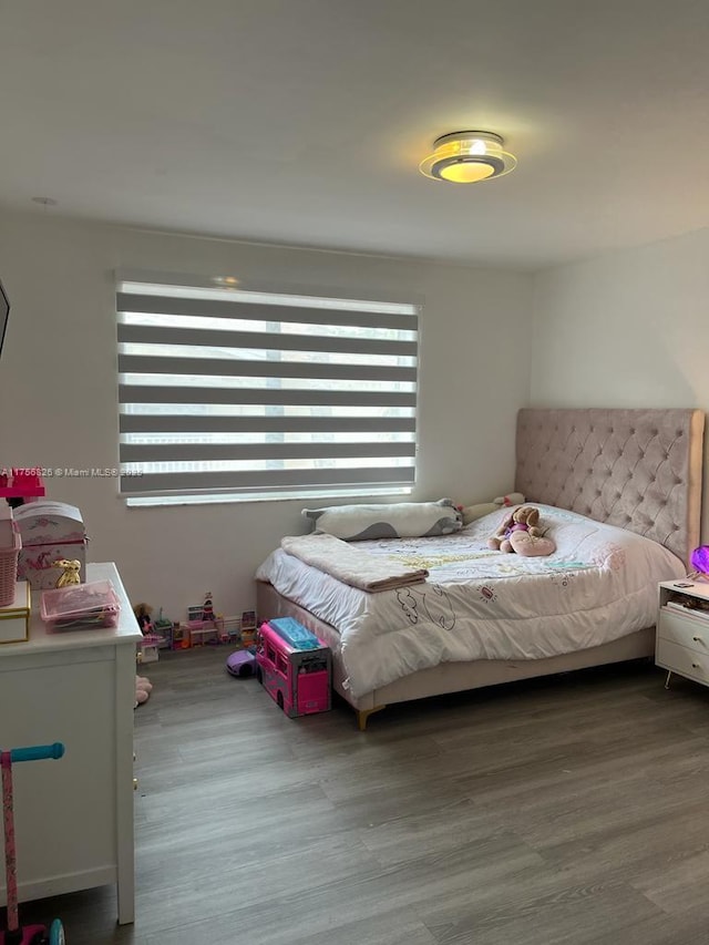 bedroom featuring wood finished floors