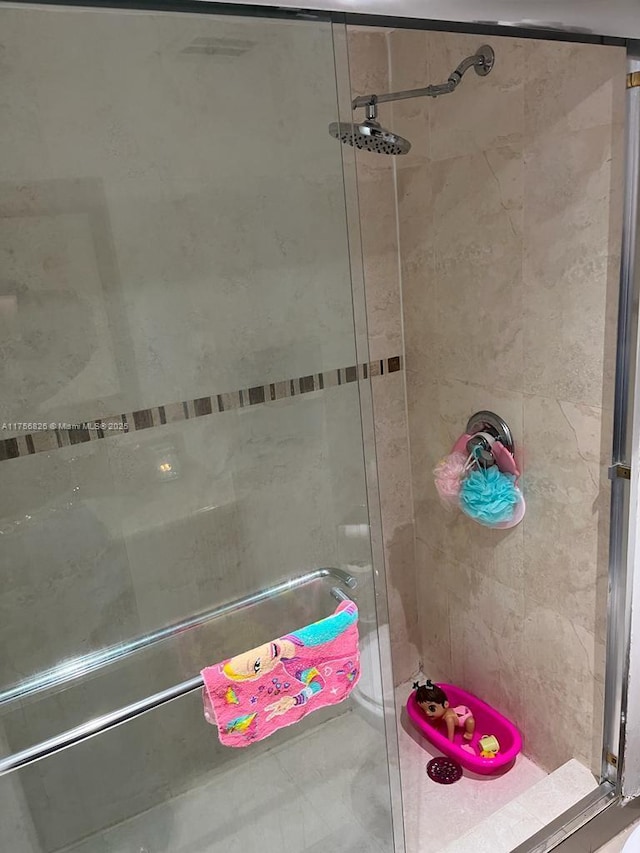 full bath featuring a shower stall