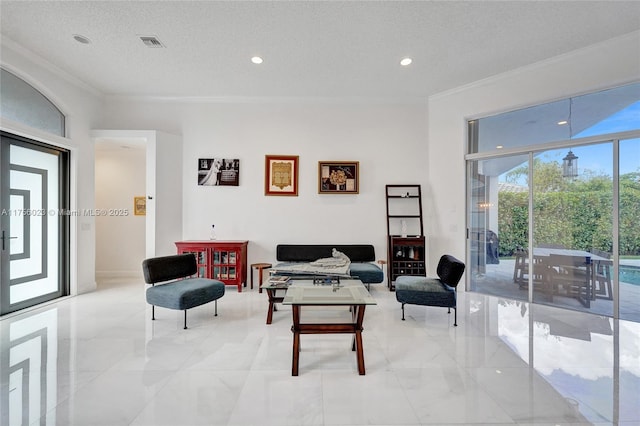 living room with crown molding, visible vents, a textured ceiling, and recessed lighting