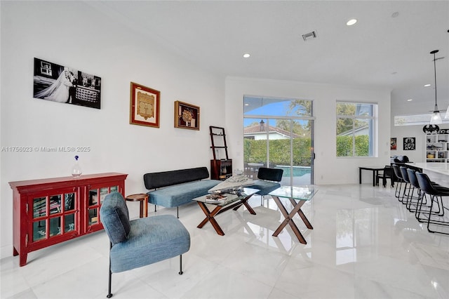 living area with visible vents and recessed lighting