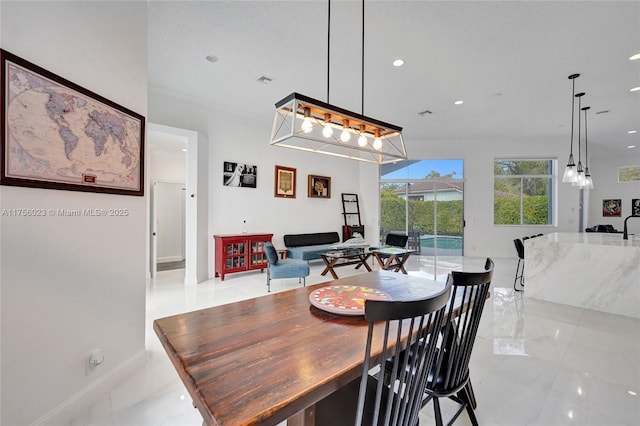 dining room featuring recessed lighting