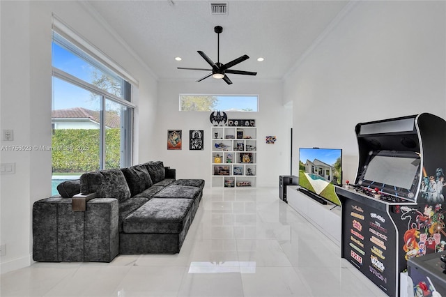 living area featuring baseboards, visible vents, crown molding, and recessed lighting