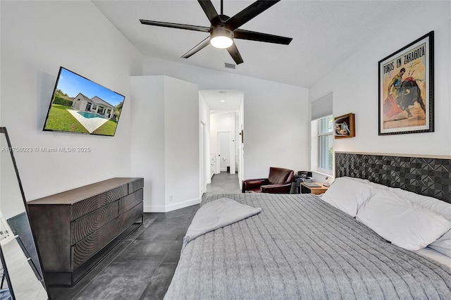 bedroom with lofted ceiling, ceiling fan, visible vents, and baseboards