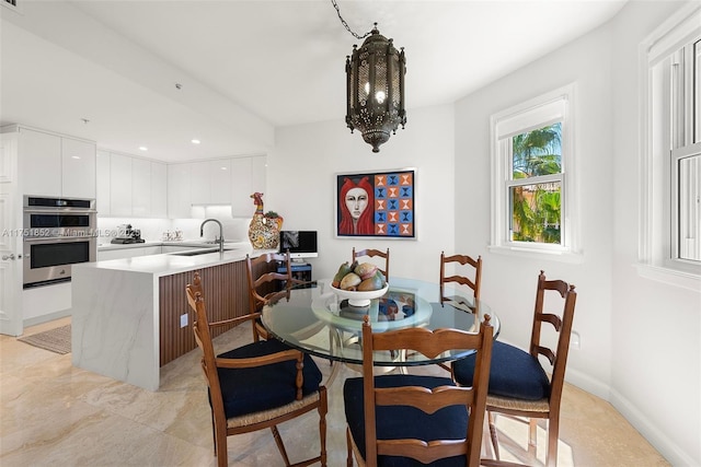 dining space with recessed lighting