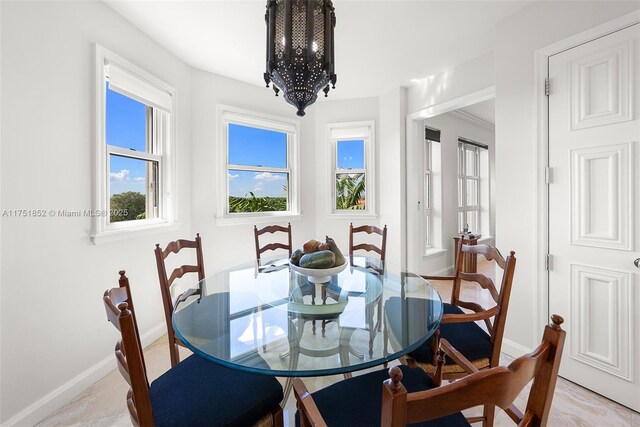 dining area featuring baseboards