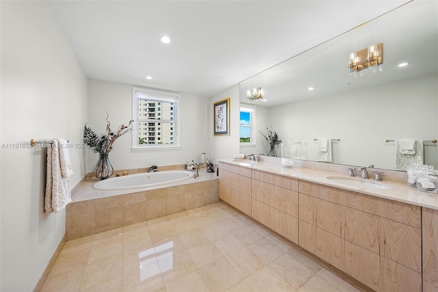 bathroom featuring recessed lighting, a garden tub, a sink, and double vanity