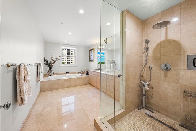 bathroom featuring recessed lighting, a garden tub, a tile shower, and tile patterned floors