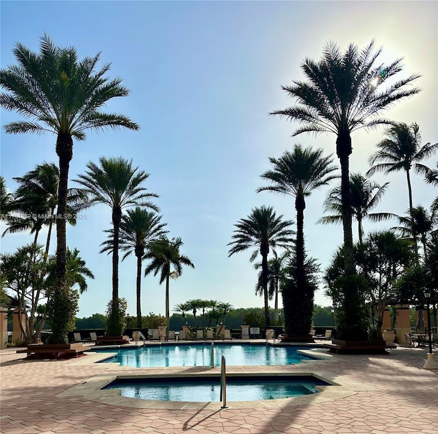 community pool with a community hot tub