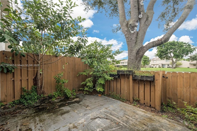 view of patio with a fenced backyard and a gate