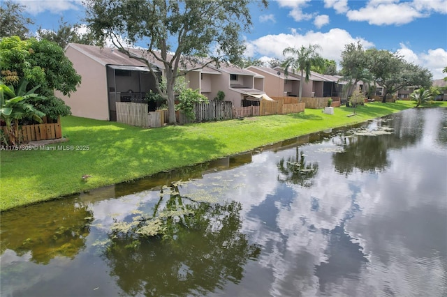 view of water feature with fence and a residential view