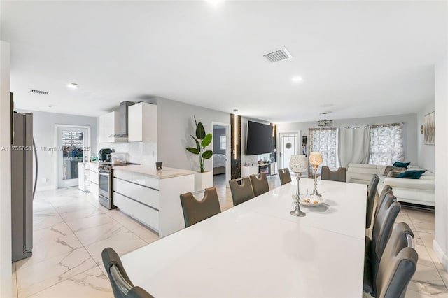 dining room featuring recessed lighting, marble finish floor, visible vents, and baseboards