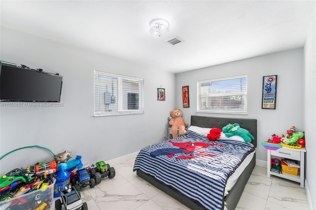 2751 NW 26th Ave, Oakland Park, FL 33311 - bedroom with marble finish floor, visible vents, and baseboards