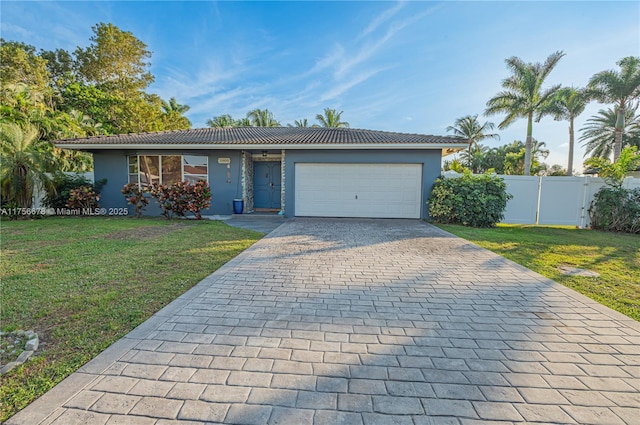 11400 Tara Dr, Plantation, FL 33325 - ranch-style house with decorative driveway, a garage, stucco siding, and a tiled roof