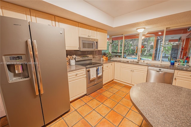 11400 Tara Dr, Plantation, FL 33325 - kitchen with appliances with stainless steel finishes, a sink, light tile patterned floors, and tasteful backsplash