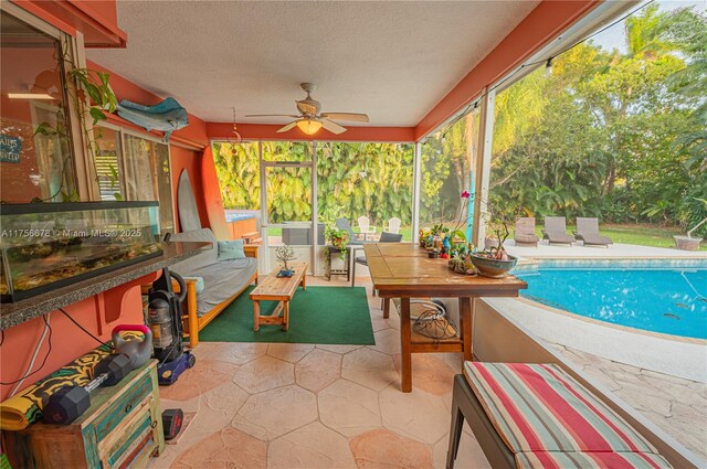 outdoor pool featuring outdoor lounge area, a ceiling fan, and a patio