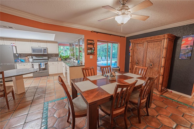 dining room with a ceiling fan, visible vents, ornamental molding, and a textured ceiling